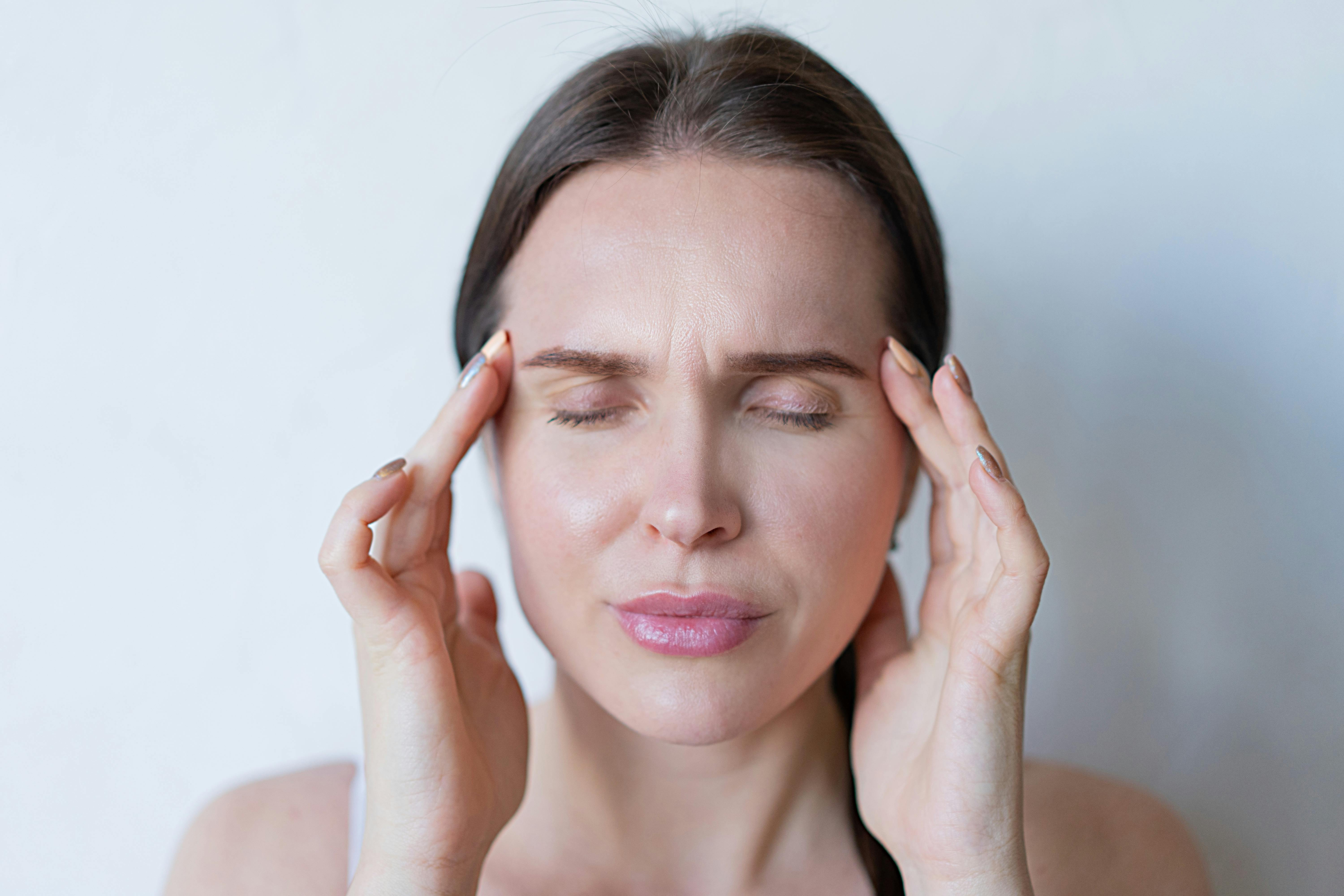 Free Woman Feeling a Strong Head Pain Stock Photo